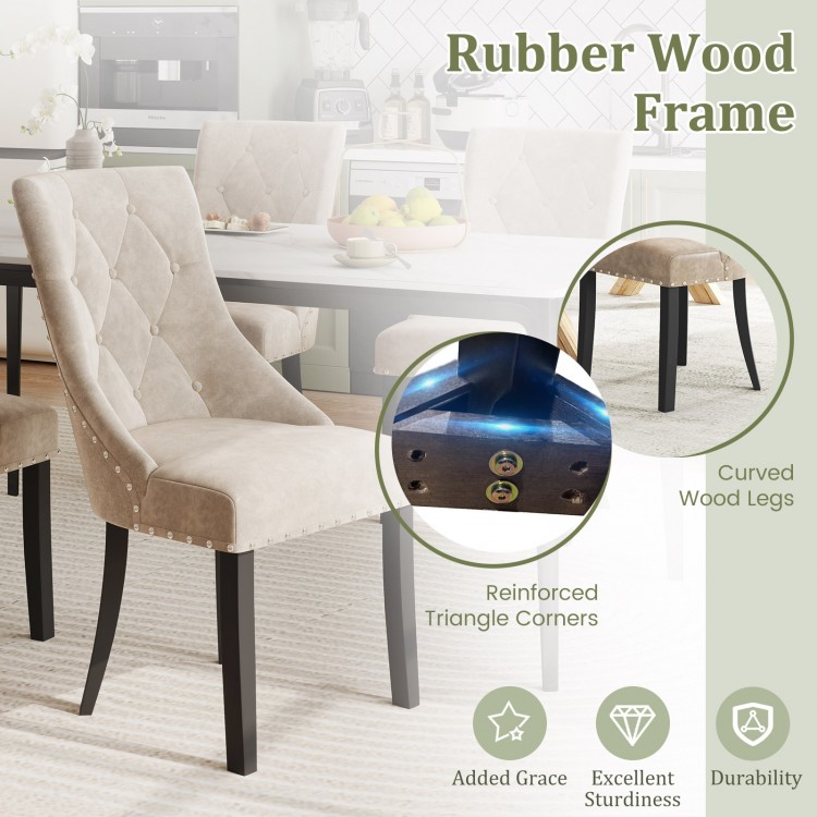 Light brown tufted wingback dining chair with rubber wood frame and nailhead trim, perfect for stylish kitchen seating.
