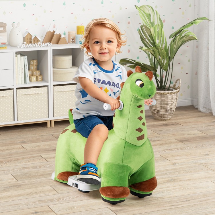 Child riding a green dinosaur ride-on toy with padded seat, foot pedal, and music features for fun indoor adventures.
