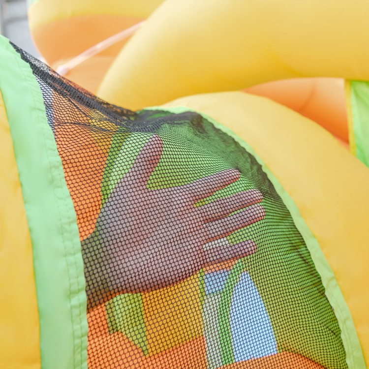 Close-up of the mesh netting on the Kids Inflatable Water Slide, showcasing safety features for summer fun.