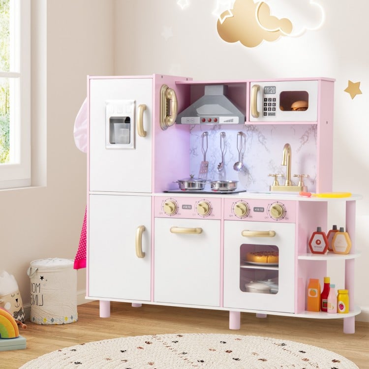 Wooden kitchen playset in pink with ice maker, lights, and sounds, perfect for imaginative play for kids aged 3+.