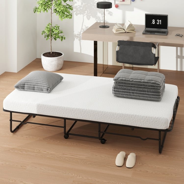 Twin size folding bed with memory foam mattress, heavy-duty metal frame, and stylish bamboo texture, ideal for easy.