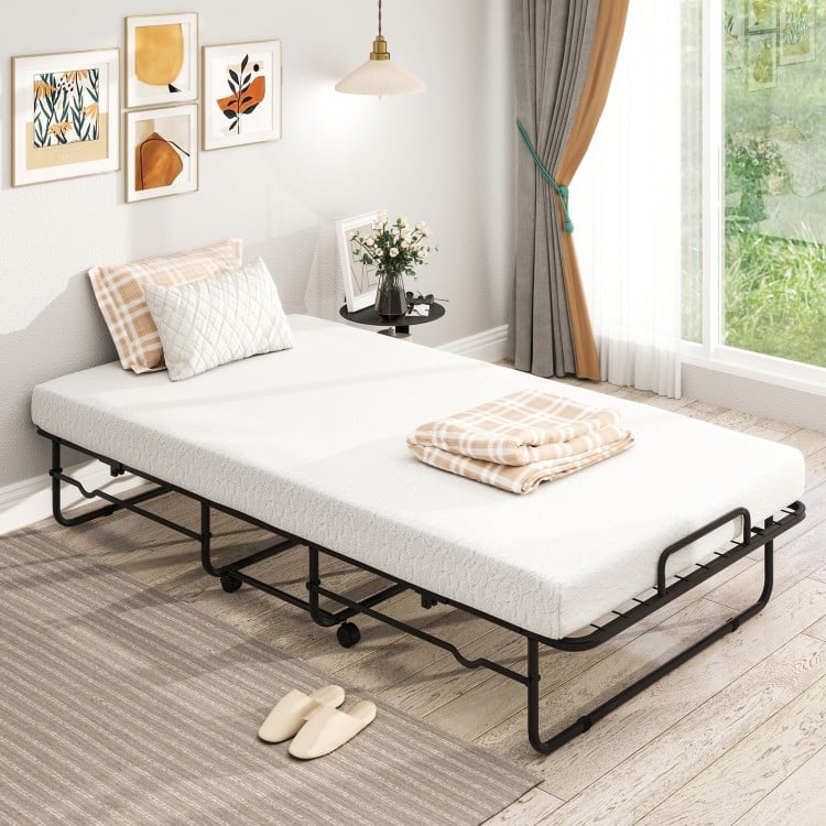 Twin size folding bed with memory foam mattress, heavy-duty metal frame, and stylish bamboo texture for easy storage.