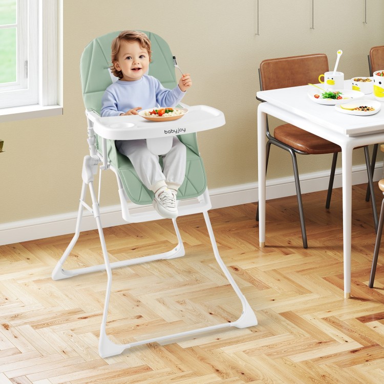 Compact highchair in green with adjustable tray and footrest, perfect for mealtime convenience and easy cleaning.