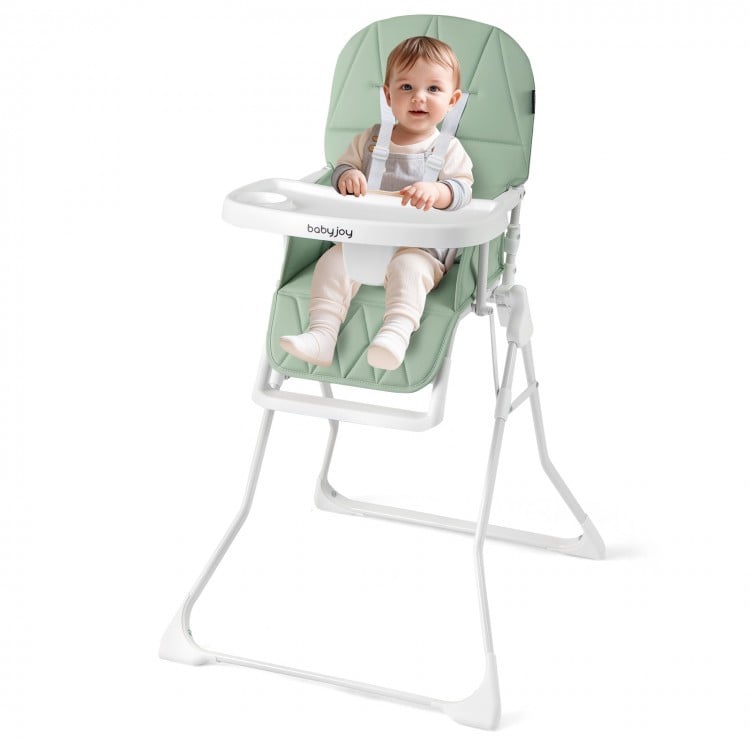 Compact highchair in green with removable tray, adjustable footrest, and safety harness for easy feeding.