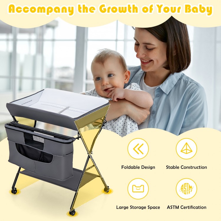 Portable adjustable height baby changing table in gray with large storage, foldable design, and lockable wheels for.