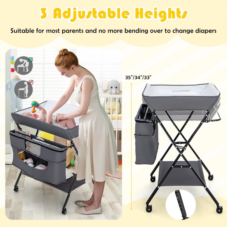Portable adjustable height baby changing table in gray with 3 heights, large storage, and lockable wheels for.