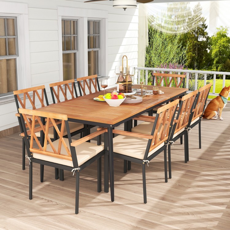 9-piece patio dining set featuring acacia wood and cushioned chairs, perfect for outdoor gatherings with an umbrella.