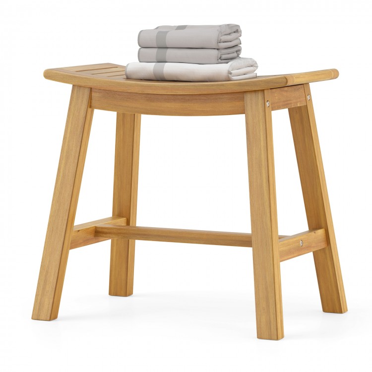 Teak wood shower stool with curved seat, slatted design for drainage, ideal for inside shower or as a shoe bench.