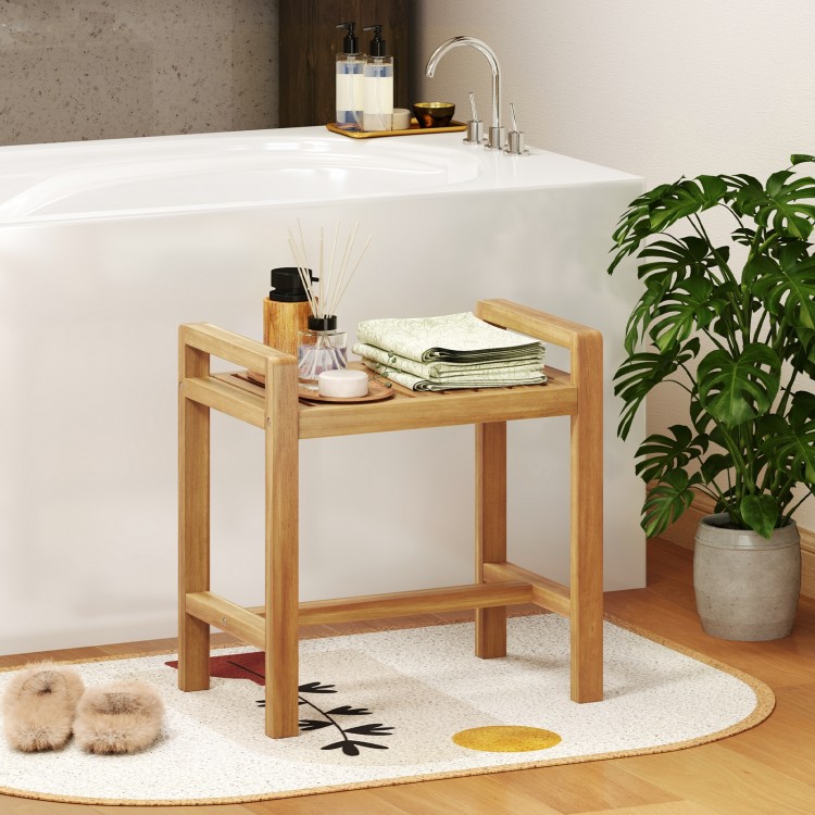 Teak wood shower bench with slat top and dual side handles, perfect for storage and use in humid bathroom environments.
