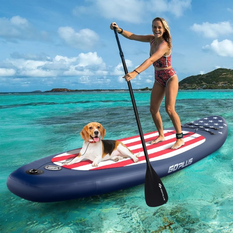 Inflatable paddle board with American flag design, featuring a removable fin and EVA foam pad for secure footing.