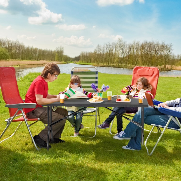 Folding picnic table with wood grain HDPE tabletop, accommodating 4-6 people, ideal for outdoor gatherings.