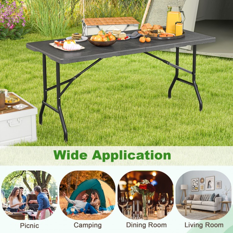 5FT folding picnic table with wood grain HDPE tabletop, portable design, ideal for outdoor and indoor gatherings.