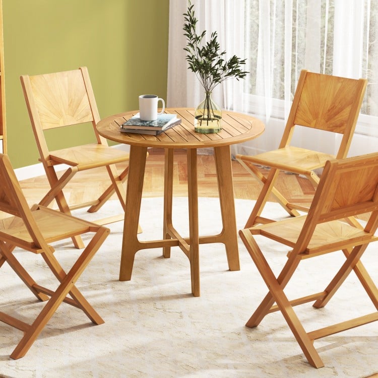 Round 31.5-inch patio dining table with slatted teak wood top and X-shaped frame, ideal for gardens and patios.