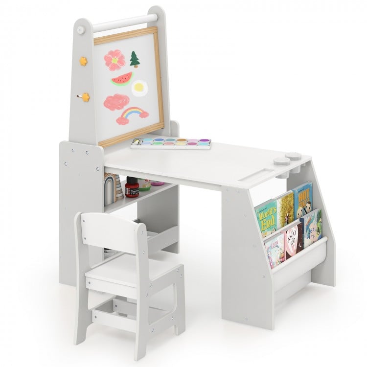 Kids art table and chair set in grey with easel, storage shelves, and accessories for drawing and reading activities.