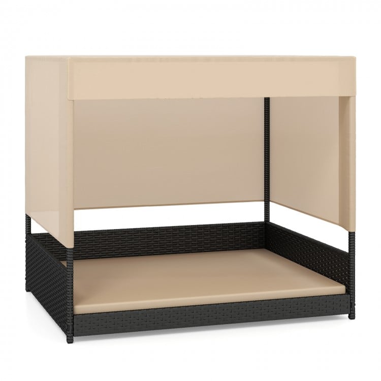 Elevated wicker dog house for small to medium breeds in black with removable cushion, suitable for indoor and outdoor.