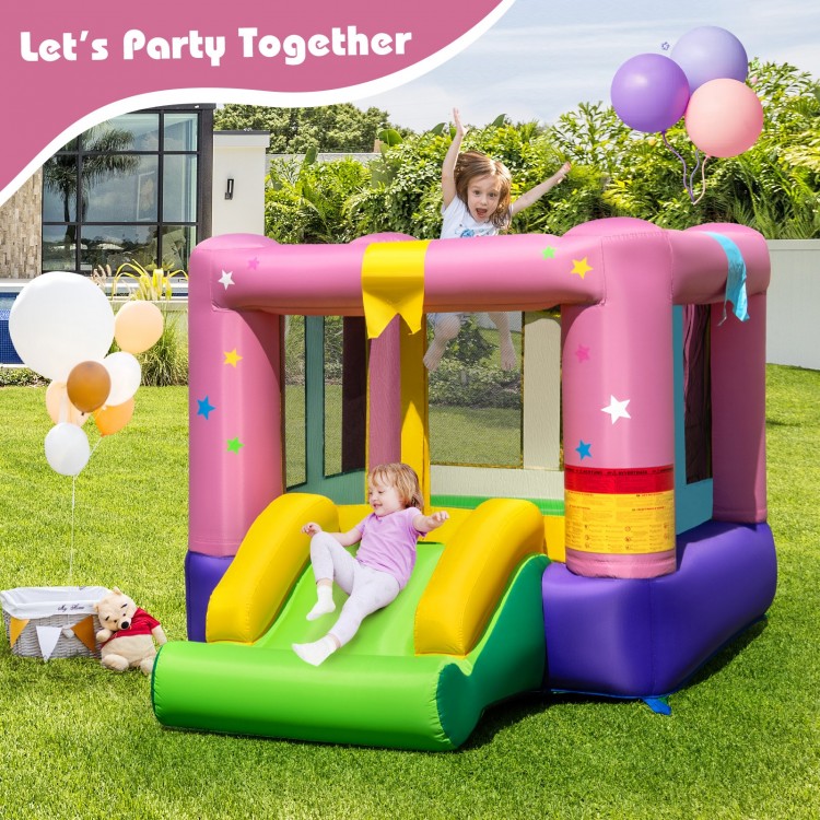 Colorful inflatable bounce house featuring a jumping area, slide, and basketball hoop for outdoor party fun.