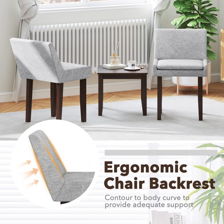 Ergonomic chair backrest and comfy upholstered chairs in gray with a brown accent table for modern living room decor.