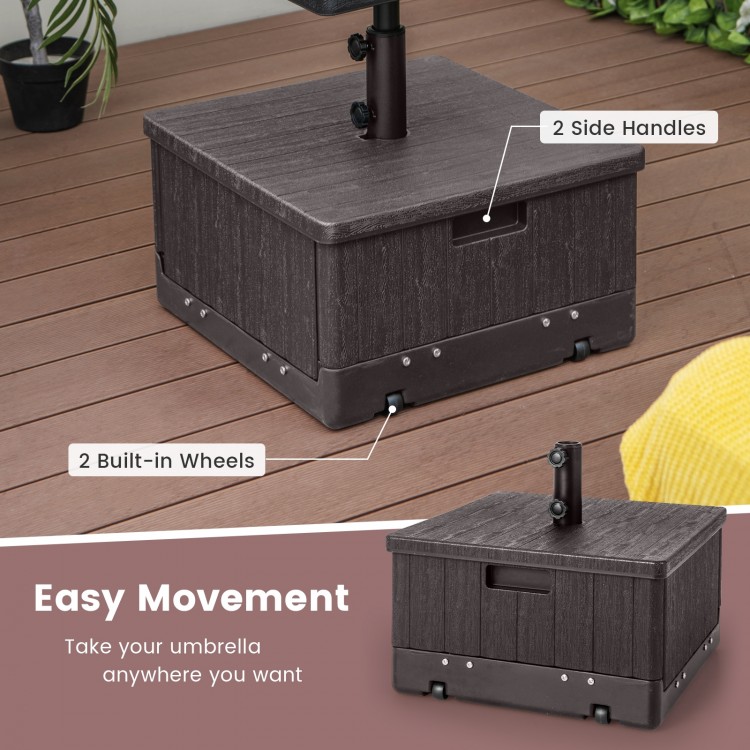 Fillable brown umbrella base with table tray, 175 lbs capacity, featuring wheels and handles for easy movement.