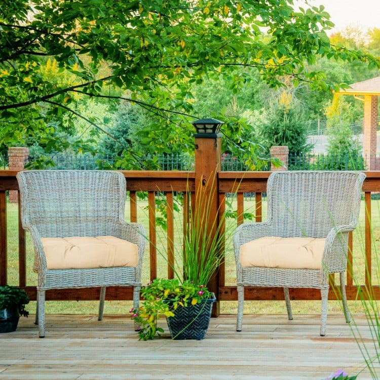 Beige 21-inch patio chair seat cushions on wicker chairs, ideal for indoor and outdoor comfort and durability.