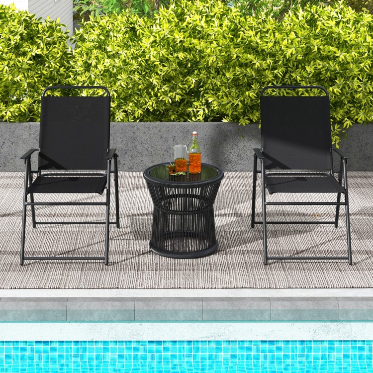 Two black outdoor folding sling chairs with armrests and a side table, perfect for poolside relaxation.