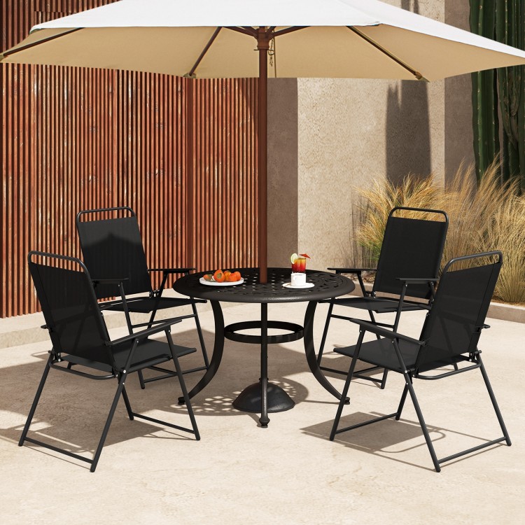 Four black outdoor folding sling chairs with armrests around a round table, perfect for patio gatherings.