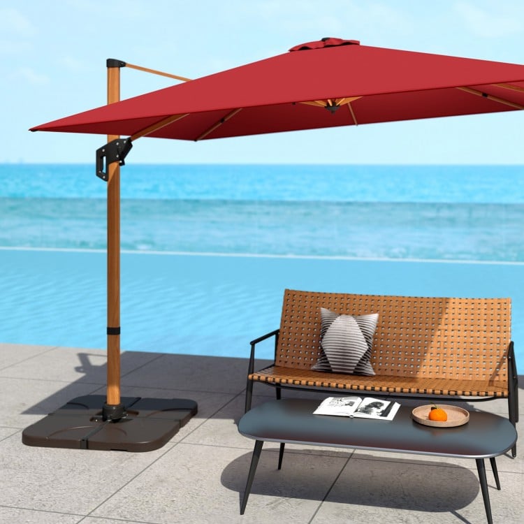 Patio offset umbrella base with detachable plates, made of HDPE plastic, filled with water or sand for stability.