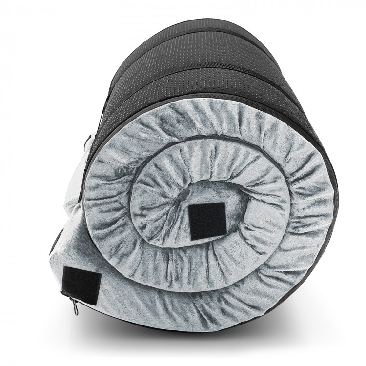 Rolled gray memory foam camping mattress with plush flannel cover and carrying bag, ideal for outdoor adventures.