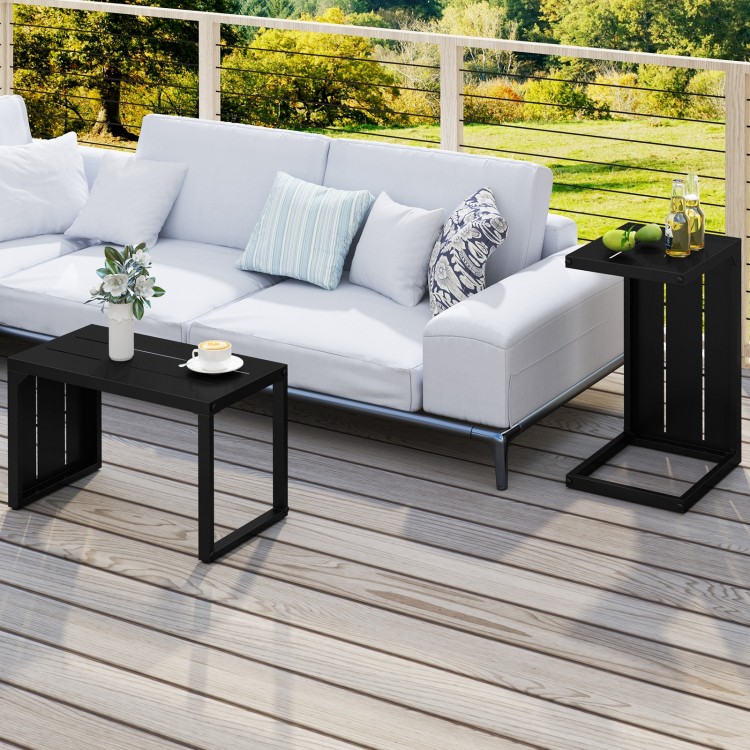 C-shaped black end table with adjustable foot pads, perfect for indoor or outdoor use, shown beside a sofa.