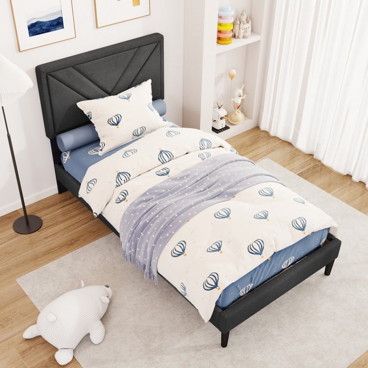Twin size upholstered platform bed with tufted headboard, faux linen fabric, and wooden slats for easy mattress setup.