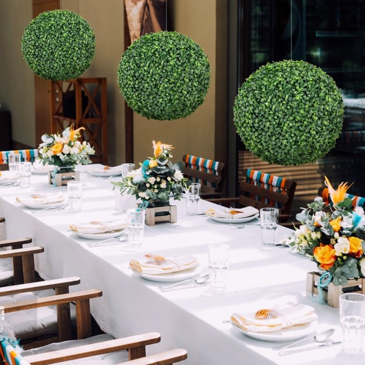 Lush green 16-inch artificial boxwood topiary balls, perfect for patio or garden decoration, hanging or tabletop use.