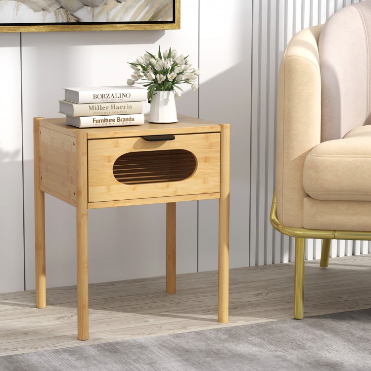 Bamboo nightstand with a decorated drawer, featuring a spacious tabletop and modern design, perfect for bedroom decor.