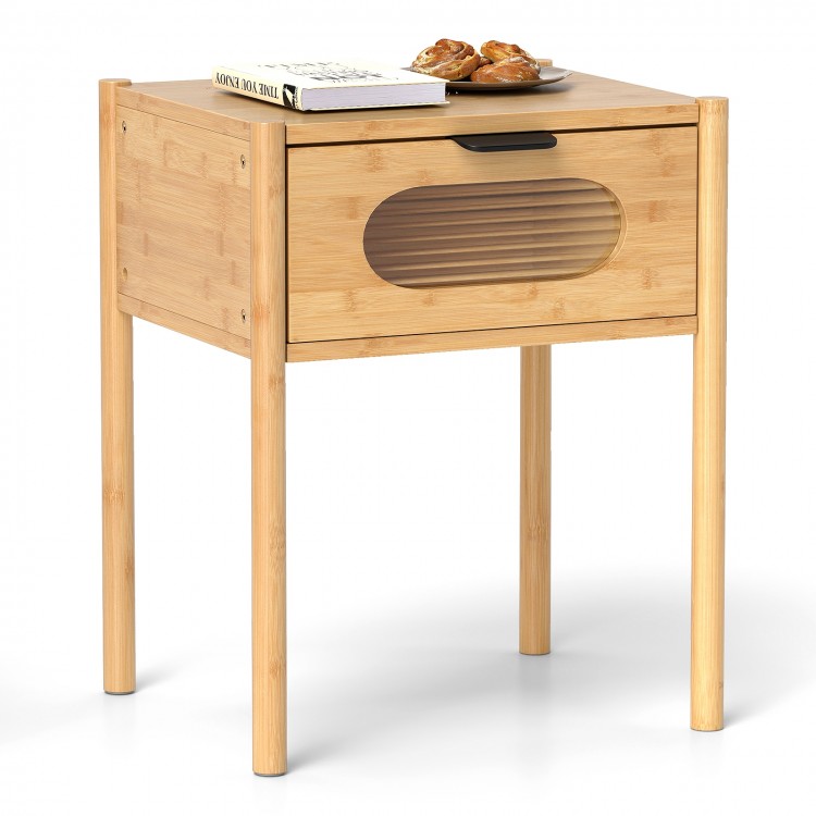 Bamboo nightstand with a spacious tabletop and reeded drawer, featuring a natural finish for stylish bedroom decor.