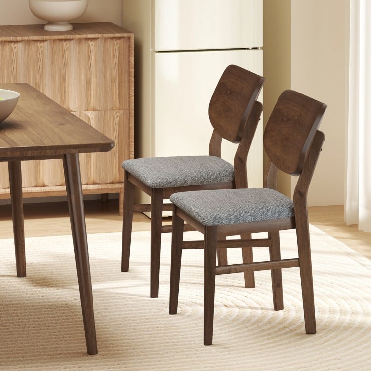 Set of 2 farmhouse upholstered kitchen chairs with rubber wood frame and gray padded seats for comfortable dining.