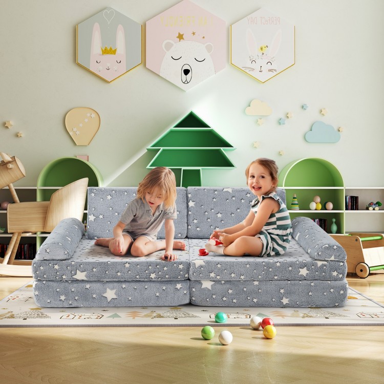 Modular kids play couch in gray with glow-in-the-dark stars, perfect for creative play in a cozy playroom setting.