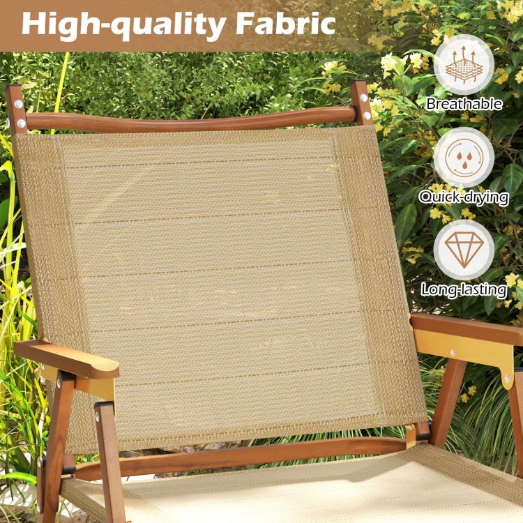 Lightweight beige folding camp chair showcasing breathable fabric and ergonomic design, perfect for beach or backyard.
