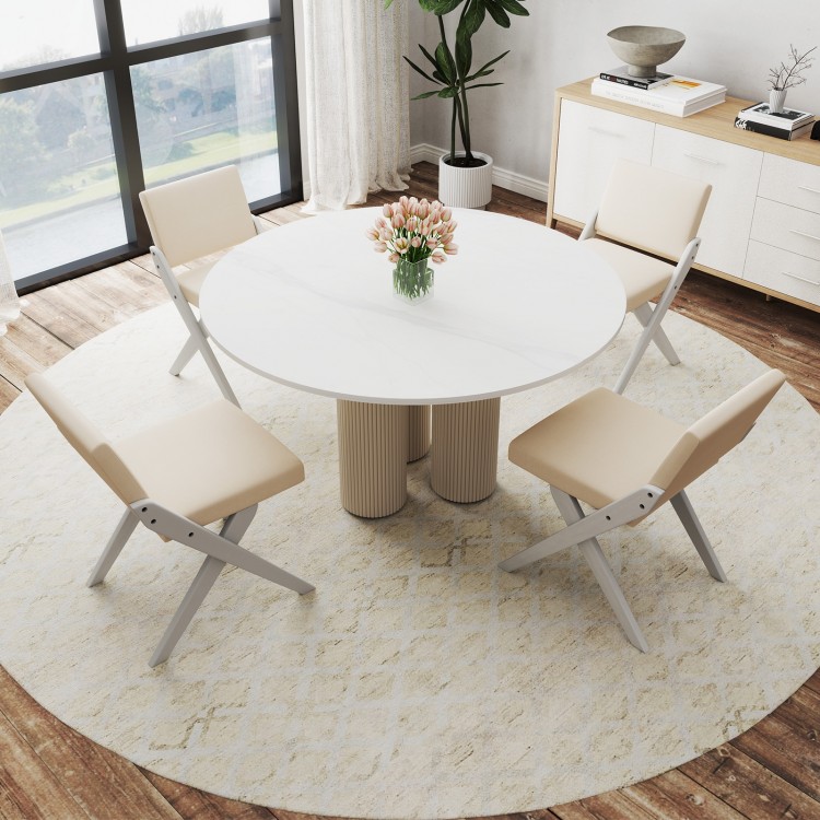 Round dining table set with two white padded rubber wood chairs, perfect for modern farmhouse aesthetics in dining.