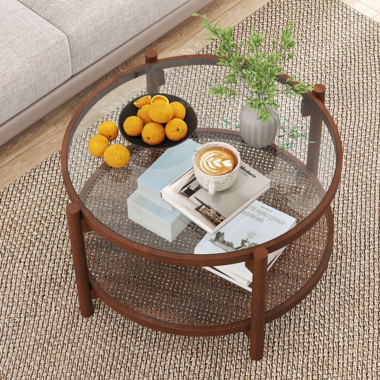 Round coffee table with tempered glass top and hand-woven rattan shelf, perfect for living room decor.
