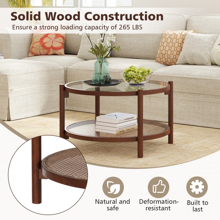 Round coffee table with tempered glass top and hand-woven rattan shelf, crafted from solid wood for living room use.