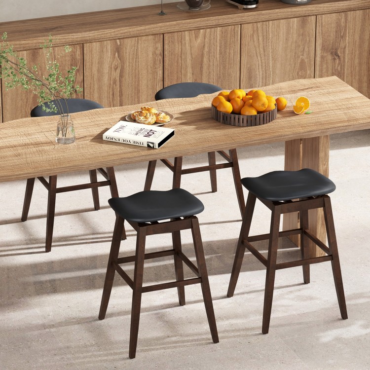 Black and brown swivel bar stools with padded contoured seats and rubber wood legs, ideal for kitchens and dining rooms.