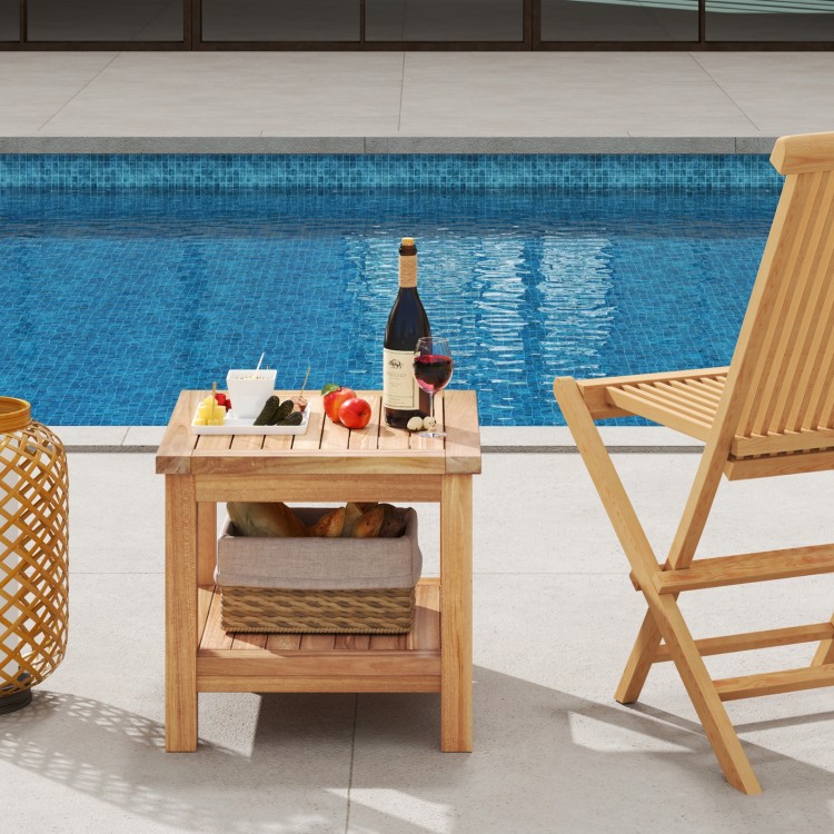 Teak wood square side table with open shelf, perfect for small spaces, shown beside a pool with drinks and snacks.