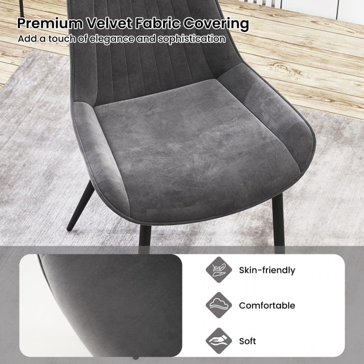 Gray dining chair with plush velvet fabric and metal legs, offering comfort and modern elegance for various settings.