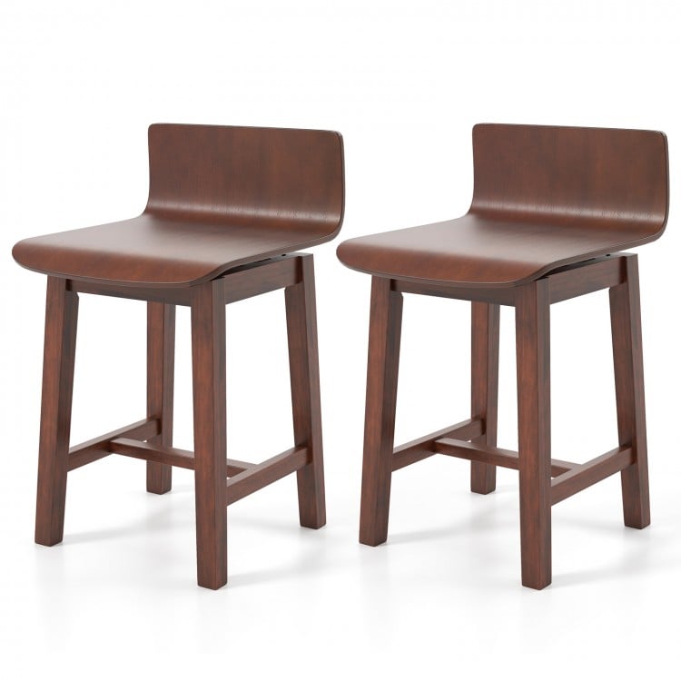 Pair of walnut swivel dining chairs showcasing low backs and curved seats, designed for comfort in any dining setting.
