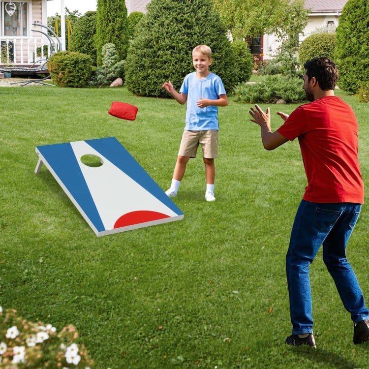 Portable 3 x 2FT cornhole board set in blue with foldable legs, featuring a child tossing a bean bag in a backyard.