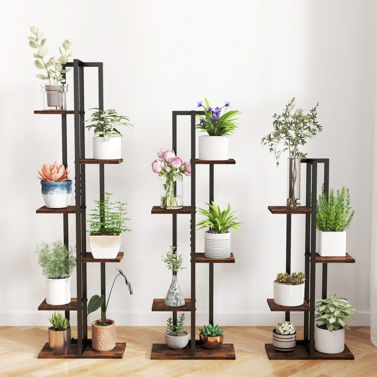 Three tall rustic brown plant stands with various tiers displaying indoor plants, perfect for stylish organization.