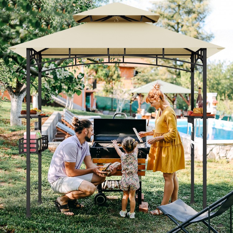 Outdoor grill gazebo with beige canopy, featuring two side shelves, hooks, and a sturdy frame for grilling convenience.