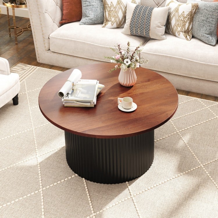 Round coffee table with walnut wooden top and wave-shaped support, perfect for versatile room settings and ample.