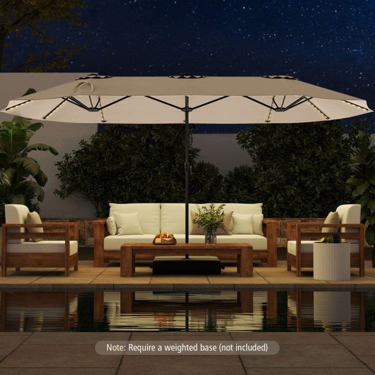 15.5 ft double-sided patio umbrella in beige with LED solar lights, providing ample shade and ambiance for outdoor.