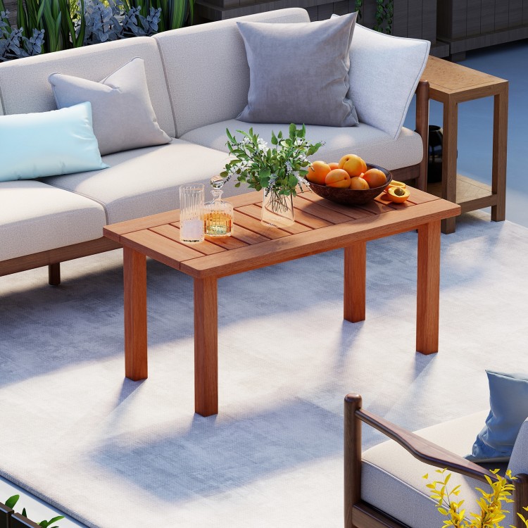 Rectangular patio coffee table with slatted tabletop, made of high-quality wood, ideal for deck or poolside use.