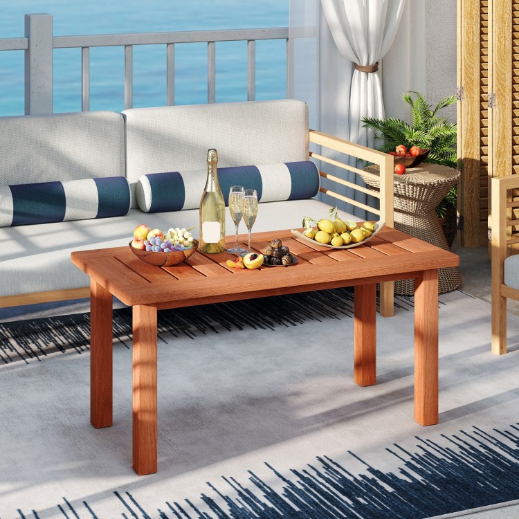 Rectangular patio coffee table with slatted tabletop, made of high-quality wood, perfect for poolside gatherings.