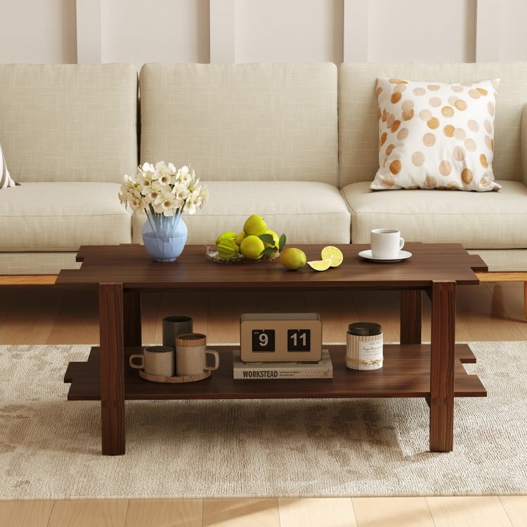 Walnut 2-tier coffee table with slatted surface and open shelf, perfect for living room storage and decor.